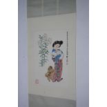 A Chinese scroll painting of an elegant lady with two Shi Tzus & tall lilies, 27” x 18”; & another