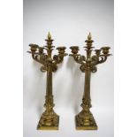 A PAIR OF 19th century GILT-BRASS TABLE CANDELABRA each with four foliate scroll arms, a central