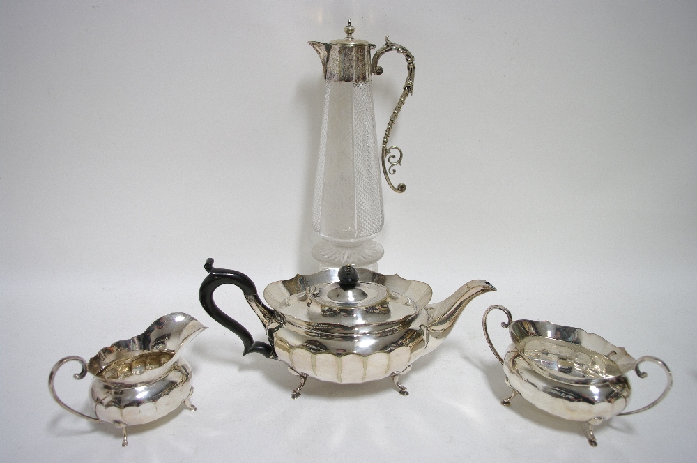 A late Victorian cut glass claret jug of round tapered form, with plated & engraved mounts, hinged