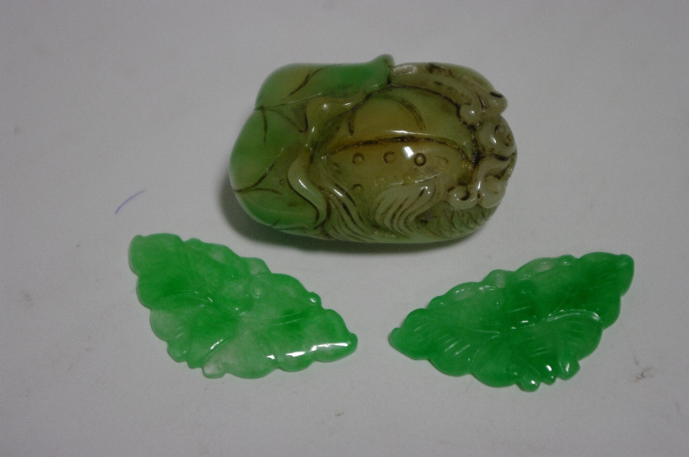 A Chinese green & mutton-fat jade carving of a fish amongst lily pads, 1½” high; & a pair of semi- - Image 2 of 2