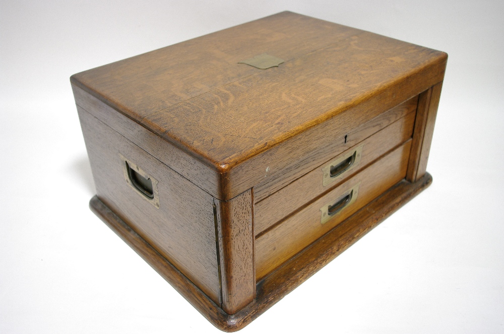 An oak canteen with lift-lid, fitted two drawers, & contents of various flatware & cutlery.