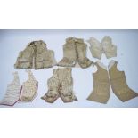 Five late 18th/early 19th century embroidered silk waistcoats; & another of later date – possibly