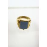 A 15ct gold signet ring set agate shield-shaped matrix, Birmingham 1921; & a silver signet ring with