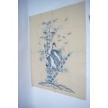 A Japanese silk needlework wall hanging depicting two cranes in a bamboo grove, smaller birds flying