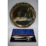 A pair of late Victorian pierced & engraved fish servers, in fitted case; & a large circular