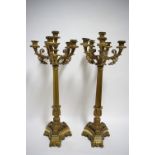 A PAIR OF 19th century GILT-BRASS TABLE CANDELABRA each with foliate scroll arms & raised central