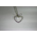 An 18ct white gold & diamond-set open heart-shaped pendant, on 18ct white gold fine-link chain
