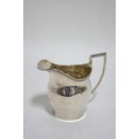 An ovoid cream jug in the early 19th century style, 4" high; Birmingham 1931, by S. Blackensee &