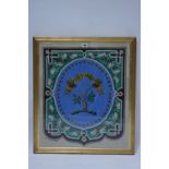 A 19th century embroidered glass beadwork panel displaying the crest & motto of Christie &