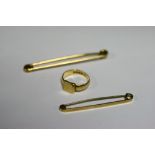 A 15ct gold tie pin; a 9ct gold ditto; & an 18ct gold signet ring.