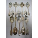 Twelve Victorian Fiddle pattern table spoons; London 1884, by Goldsmiths’ Alliance (JSH). (28oz.)