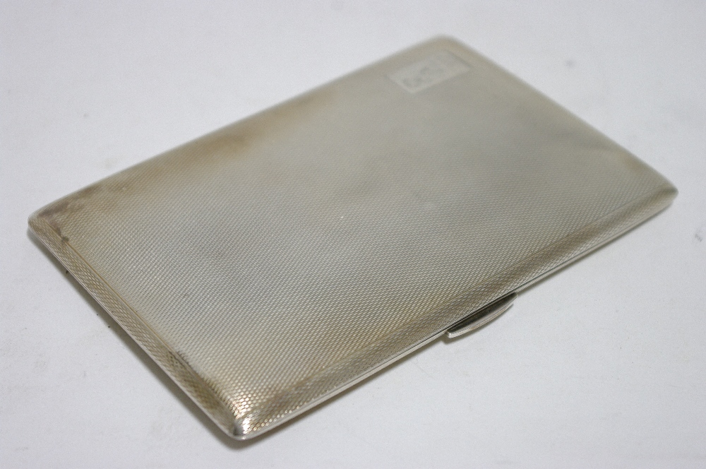 A rectangular engine-turned pocket cigarette case, 5" x 3¼"; Birmingham 1946, by Mellow