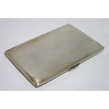 A rectangular engine-turned pocket cigarette case, 5" x 3¼"; Birmingham 1946, by Mellow