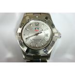 A Tag Heuer “Aquaracer” ladies’ wristwatch, the silvered dial with luminous baton numerals &