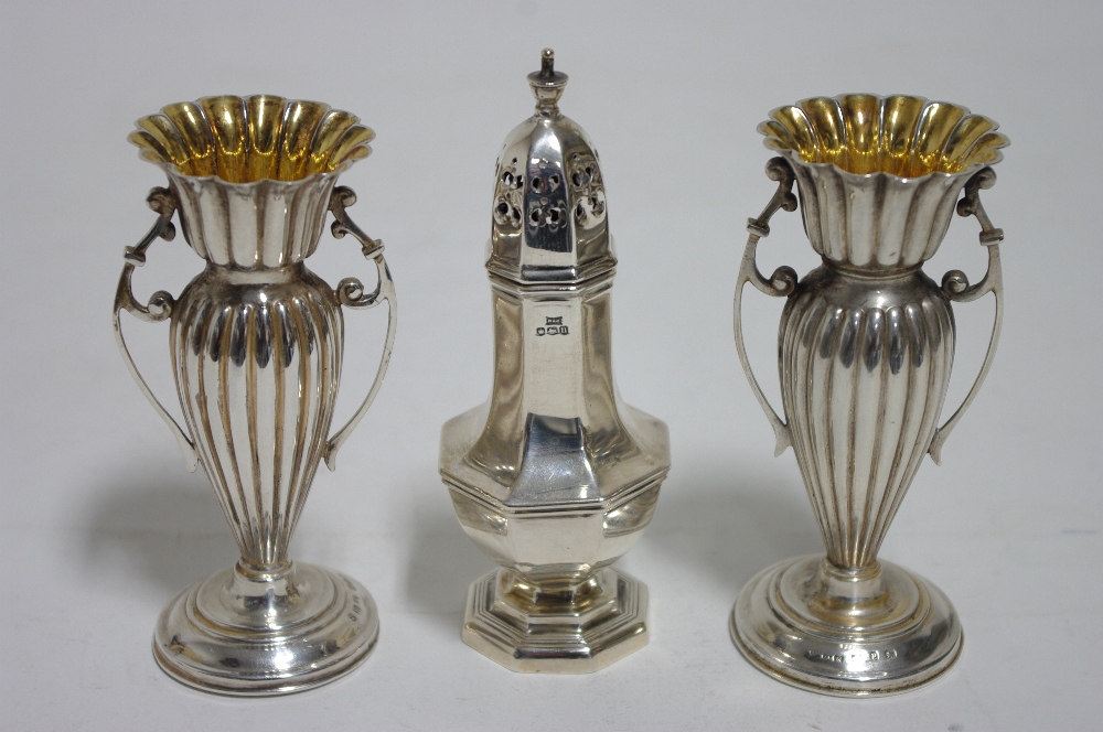 A pair of late Victorian two-handled posy vases of slender ovoid form, each on round pedestal