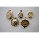 Four yellow metal pendant lockets; & a silver-gilt masonic pendant.