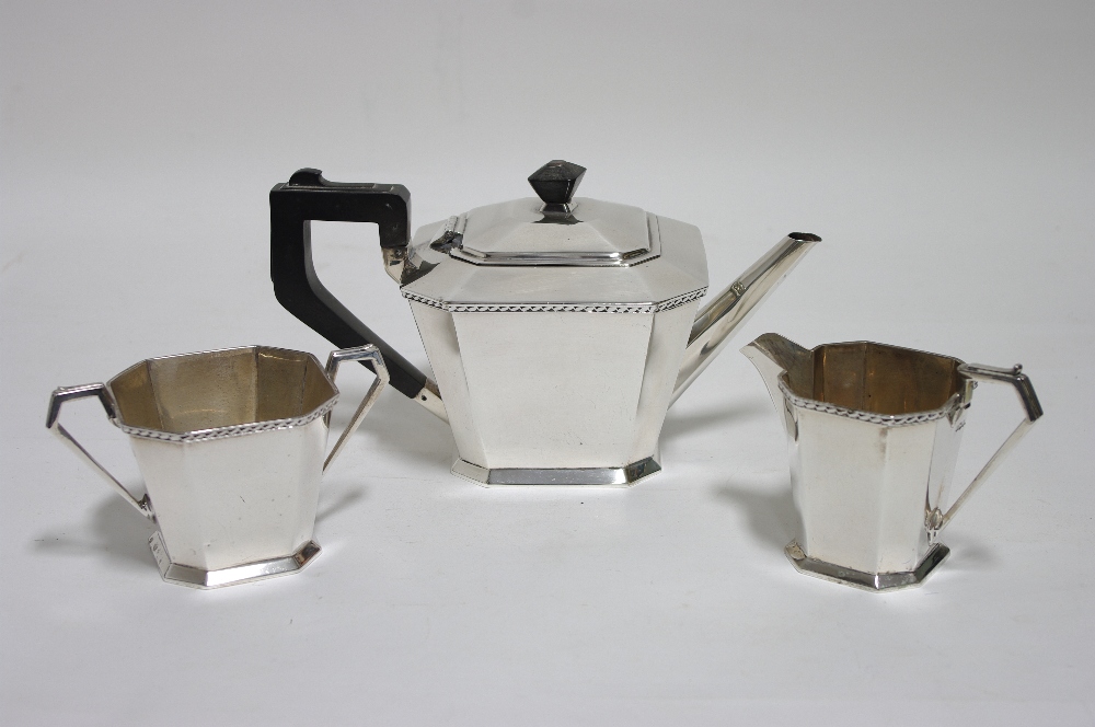 A George V three-piece tea service of square tapered form with canted corners & narrow zig-zag