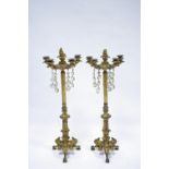 A PAIR OF 19th century GILT-BRASS TABLE CANDELABRA each with five short foliate arms hung with glass