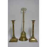 A 19th century brass bell-shaped door porter with long ring handle; a pair of late 18th century