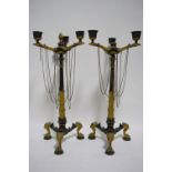 A pair of 19th century gilt-metal & bronzed classical style three-branch candelabra, each on slender