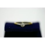 An 18ct. gold ring set small diamond