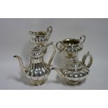 A WILLIAM IV MELON-SHAPED FOUR PIECE TEA & COFFEE SERVICE, the coffee pot & teapot each with cast