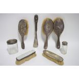 Three silver-backed hair brushes; two ditto clothes brushes; a shoe-horn; & two glass dressing table