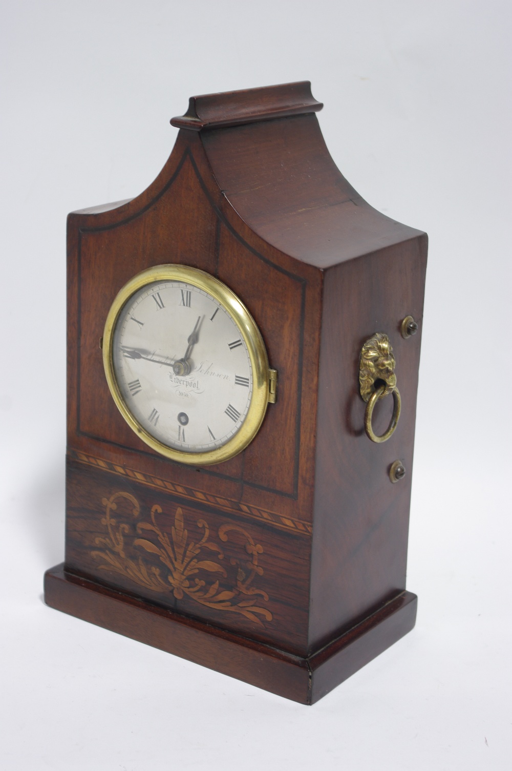 A REGENCY MANTEL TIMEPIECE in mahogany & rosewood case with “pagoda” top & marquetry panel to the