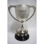 A GEORGE V LARGE TWO-HANDLED TROPHY CUP of ovoid form, with engraved inscription & town arms of