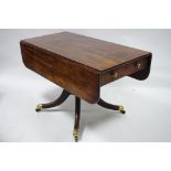 A regency mahogany drop-leaf supper table fitted drawer to either  end, on turned centre