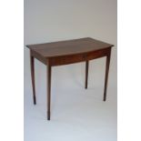 An early 19th century mahogany bow-front side table fitted frieze drawer & on slender square tapered