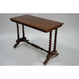 A mid-Victorian mahogany centre table with rectangular top, on pairs of barley-twist supports to