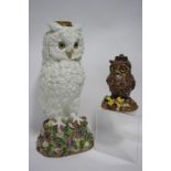 A late 19th century Whitman & Roth porcelain large oil lamp in the form of a snowy owl, on floral-