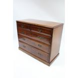 A late Victorian walnut chest fitted two short & three long drawers with brass handles, on plinth