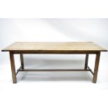 A 19th century OAK REFECTORY TABLE, the three-board top with cleated ends, fitted shallow drawer