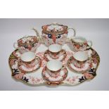 AN EDWARDIAN CROWN DERBY “IMARI” PATTERN CABARET, pattern number 2712, comprising: a shaped oval