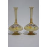 A pair of Royal Worcester porcelain squat round vases with tall narrow necks, blush ivory ground