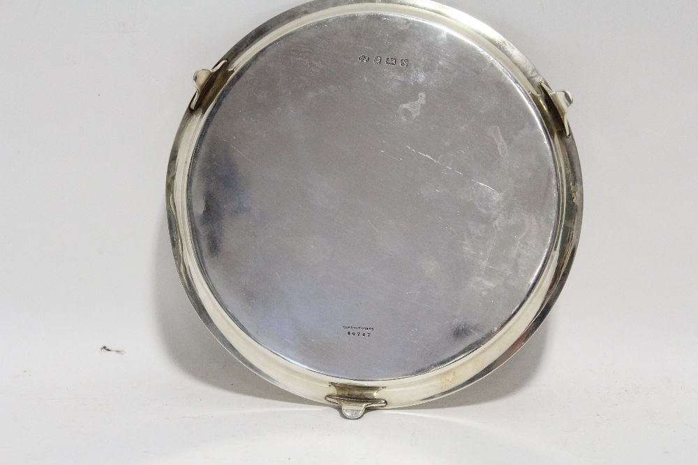 A George V plain circular waiter with raised border & reeded rim, on three curved feet, 8” diam., - Image 2 of 2