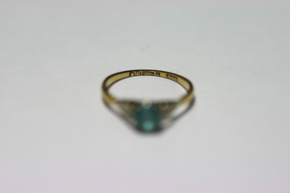 A 9ct gold ring set aquamarine (London 1950); a 9ct gold ring set three graduated garnets; five - Image 2 of 5