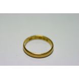 A 22ct. gold wedding band (2.8 gm); two 9ct gold signet rings (6.4 gm); & a 9ct gold signet ring set