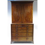 A LATE GEORGE III FIGURED MAHOGANY SECRETAIRE BOOKCASE, die-stamped: “JAMES GREENWOOD, 1811”, the