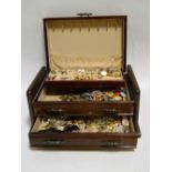 A quantity of costume jewellery, etc., contained in a mahogany-finish jewellery box with lift