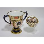 A Royal Crown Derby porcelain “Imari” pattern silver-shaped two-handled cup on round pedestal