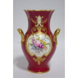 A Royal Crown Derby porcelain two-handled baluster-shaped vase in the Chelsea style, claret ground