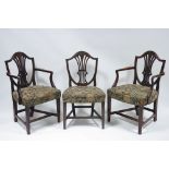 A set of eight Hepplewhite style mahogany dining chairs, including a pair of carver chairs, with