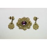 A Victorian oval seed pearl brooch with scroll border, set foil-backed amethyst (w.a.f.); & a pair