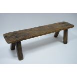 A rustic hardwood narrow oblong bench on four square splay legs; 59” x 12”.