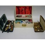 A quantity of costume jewellery, etc., contained in a white simulated morocco jewellery box.