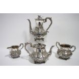 A VICTORIAN FOUR-PIECE TEA & COFFEE SERVICE embossed with panels of game birdrs amongst corn, the