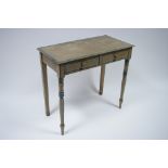 An early 19th century painted side table fitted two frieze drawers, & on turned tapered legs; 33”